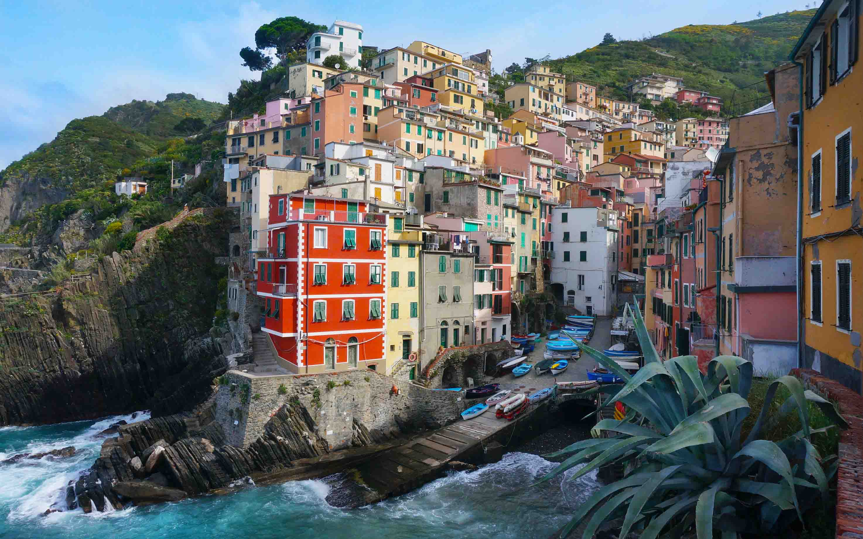 View of buildings built into coastal cliffs