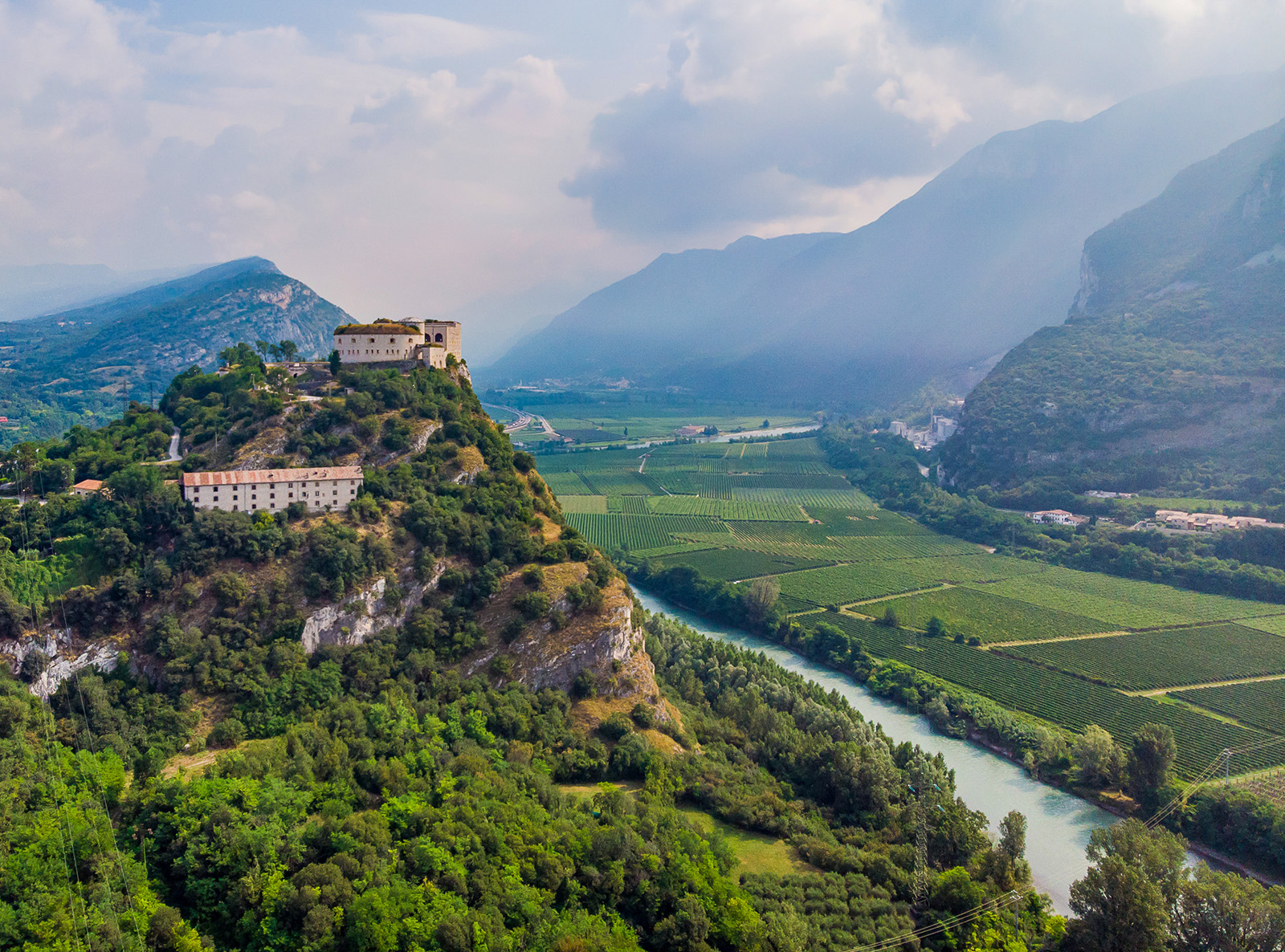 Village on a hill above a river in Italy