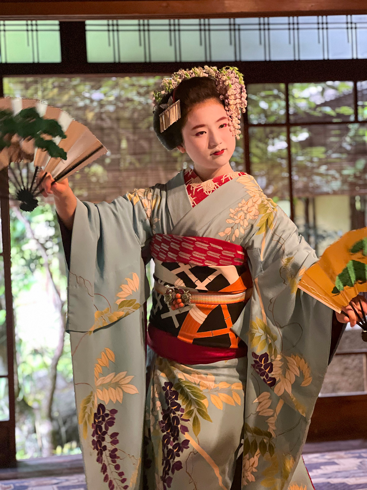 Japanese woman in a kimono performing