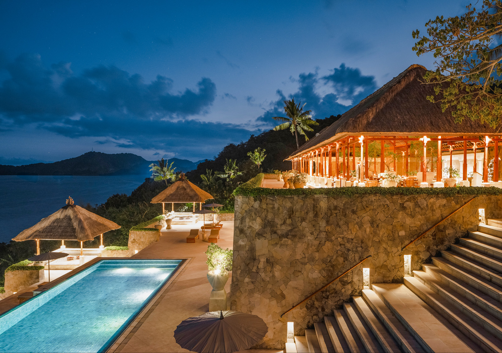patio overlooking large pool during sunset