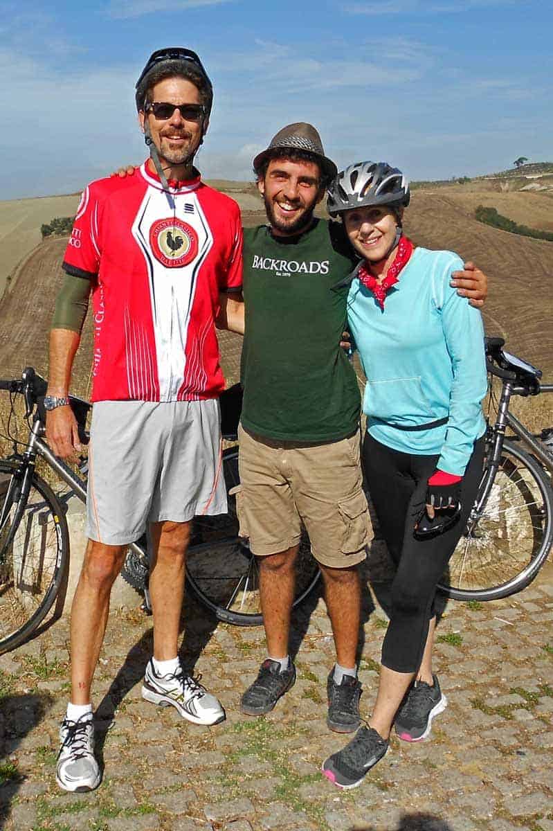 A backroads trip leader with two cycling guests
