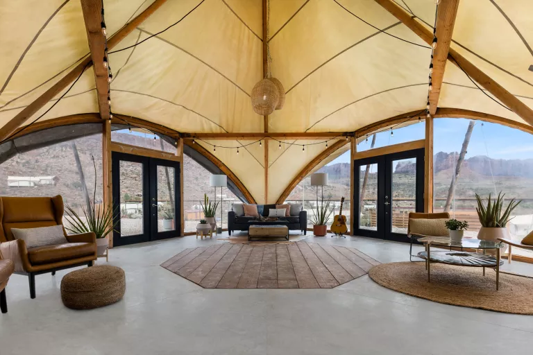 Large, luxury hut with wooden furniture and leather, cushioned seats
