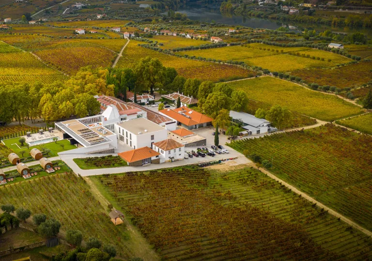 Birds eye view of hotel surrounded by grassland