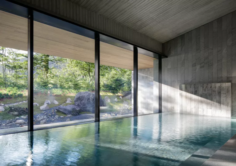 Hotel swimming pool with light streaming in through window