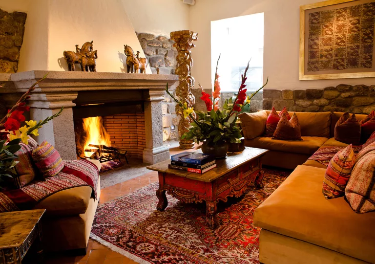 couch and coffee table around a fireplace