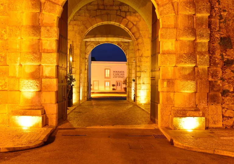 Stone archways leading to hotel entrance