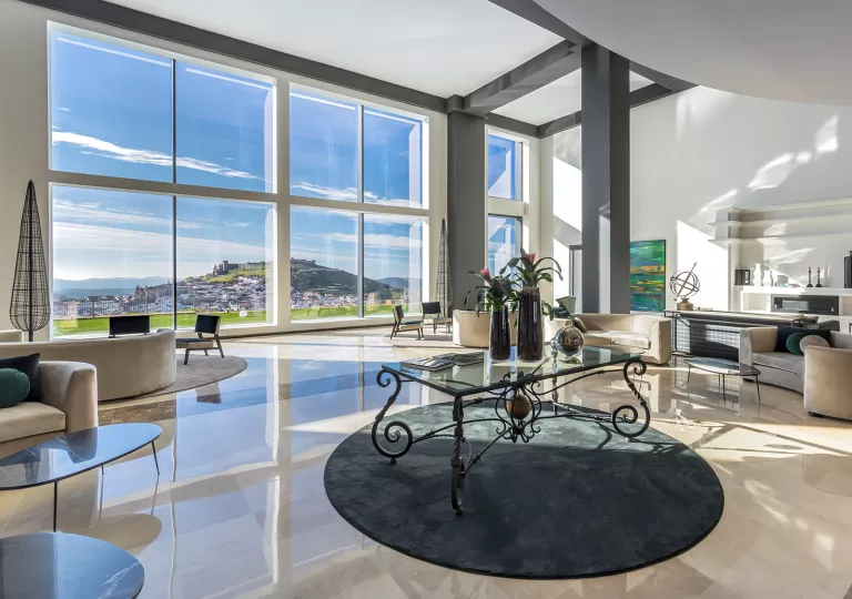 Glass table in the middle of an open lobby