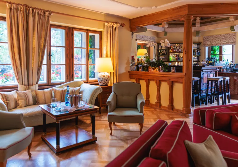 Indoor lounge with a wooden bar on the right