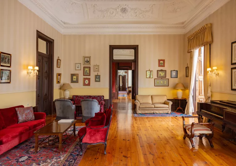 living room with wood floors and velvet couches