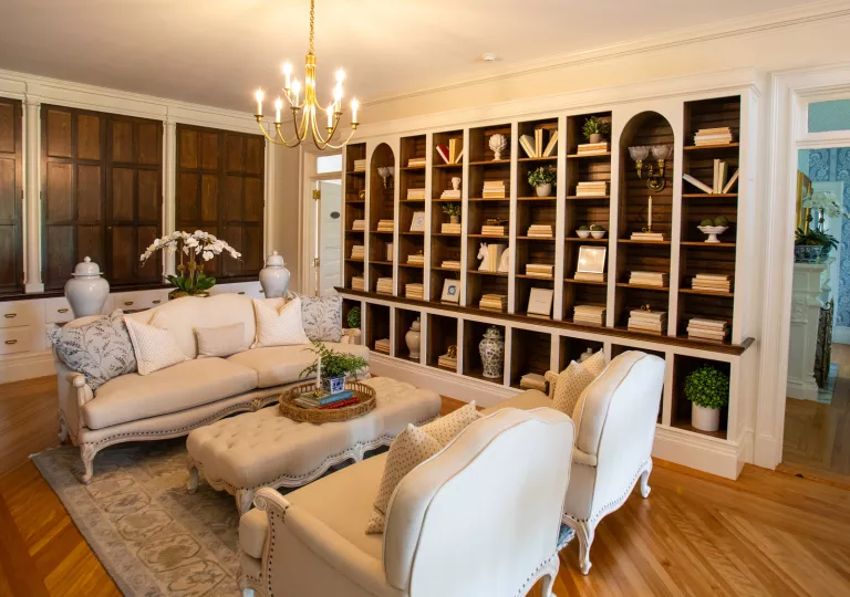 Library with cushioned sofas and books in the shelving