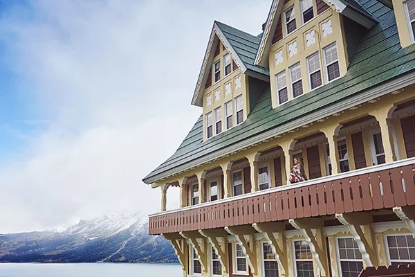 colorful hotel building in front of mountain range