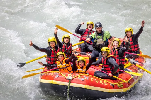 Group of guests white water rafting.