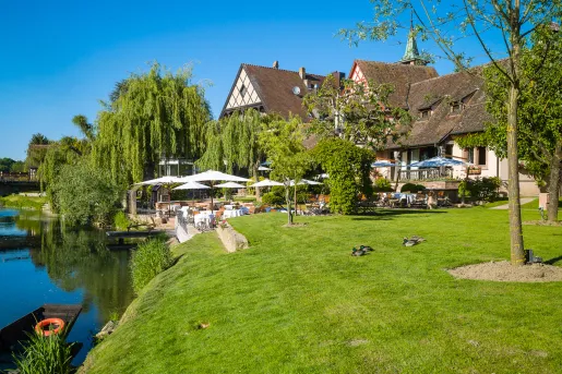 hotel and lawn next to water
