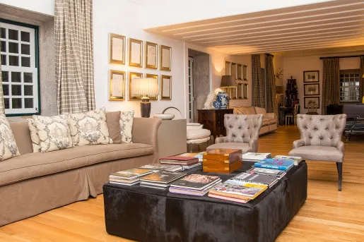 hotel lobby with couch and chairs around a coffee table