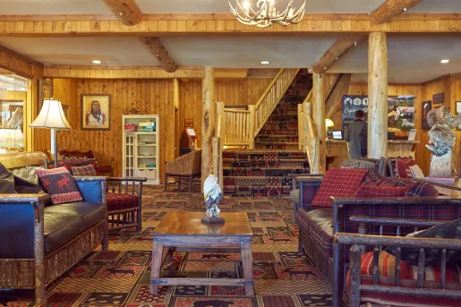 Lodge lobby with leather couches and a concierge