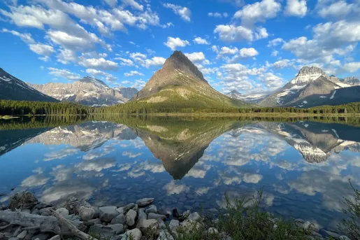 Mountain with a lake in front with the reflection on the lake