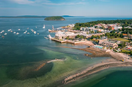 Seaside town with boats scattered in the ocean