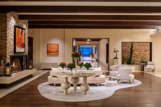 Indoor lobby with a white couch over a white rug