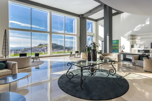 Glass table in the middle of an open lobby