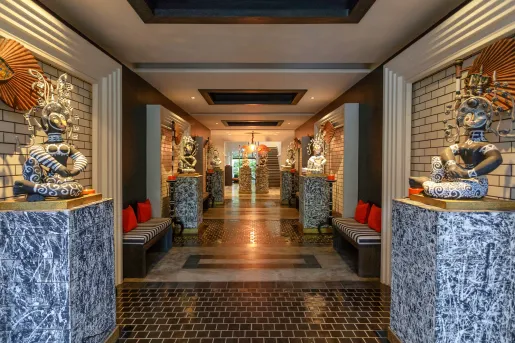 hallway decorated with columns and statues