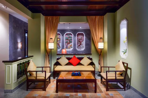 Indoor seating area, with cushioned chairs and a center coffee table