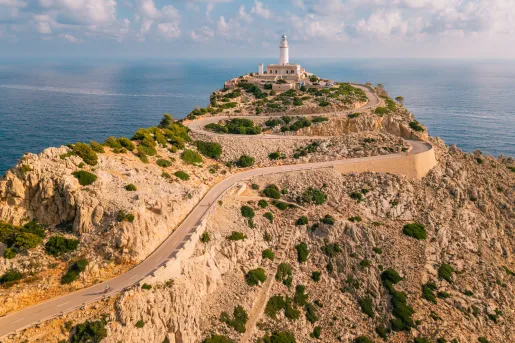 Long road along a cliff, leading to a lighthouse