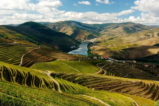 Valley with large hills and a river in the distance