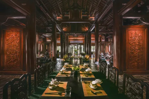 Large dining hall with carved, wooden walls