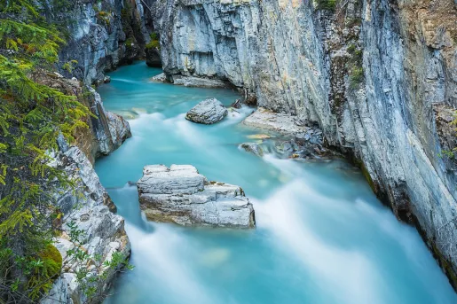 Blue water river in the middle of two large canyons