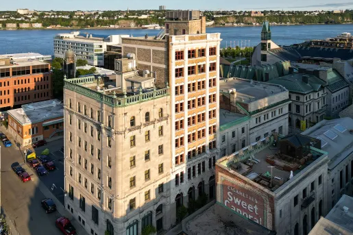 Exterior view of hotel building in the middle of a downtown city area