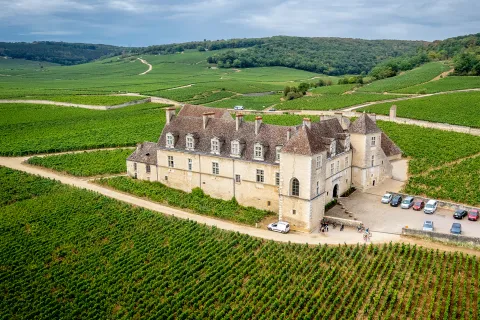 Building Surrounded by Fields and Hills