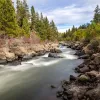 Wide shot of quickly flowing river.