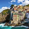 Cliffside by the ocean with buildings on top