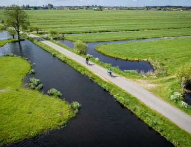 Ariel view of bikers in fields with ponds