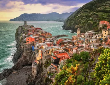 Wide shot of Cinque Terre coastal village.