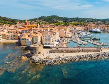 European, beach-side town with beige buildings by the water